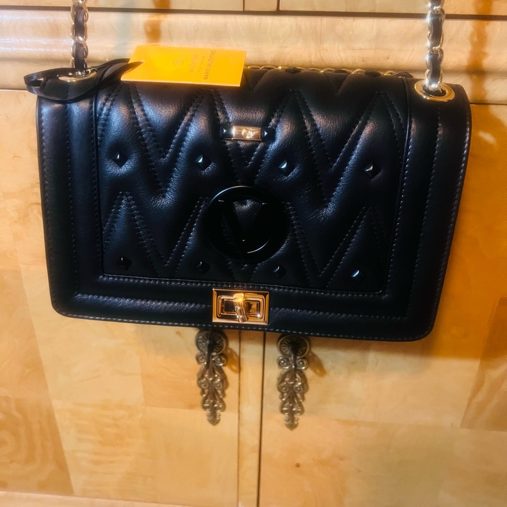 Elegant Black Quilted Shoulder Bag
New with tags